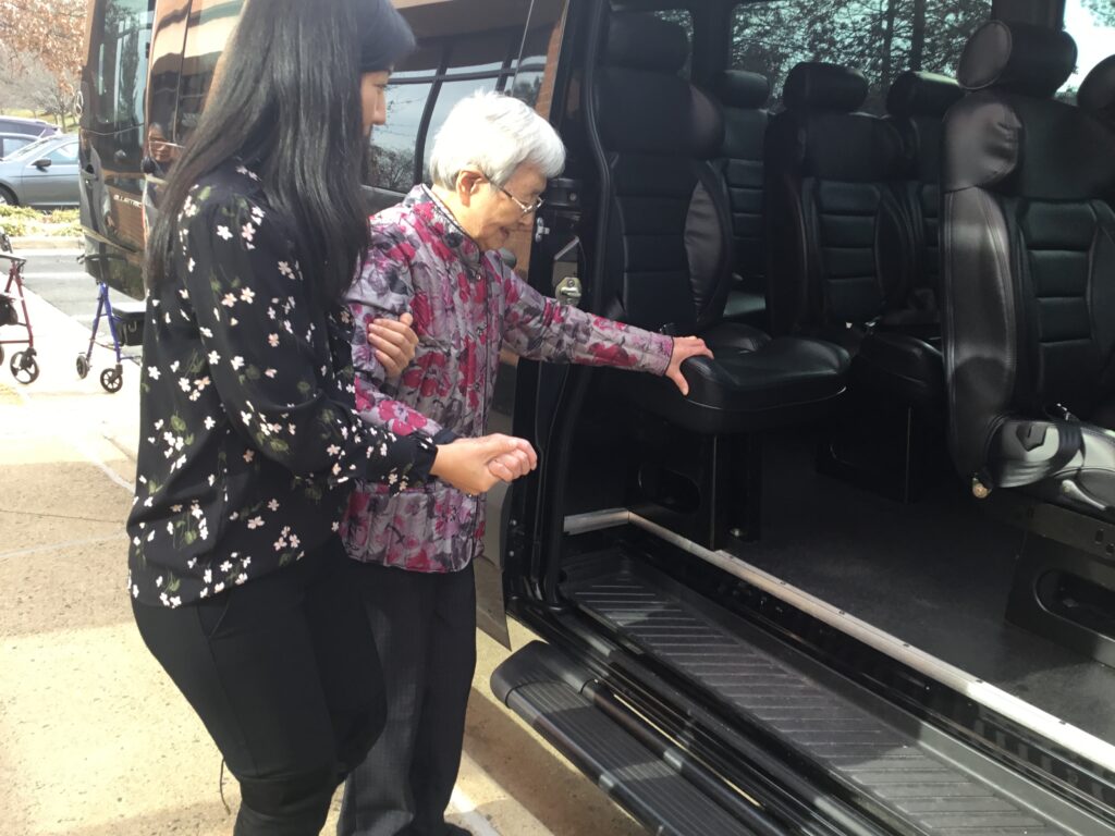 Helping a senior into a vehicle